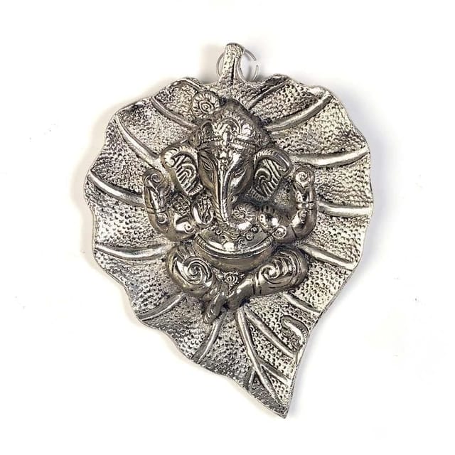 white metal wall hanging of Ganpati on leaf (10187)